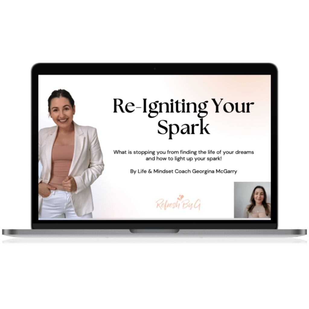 Image of a laptop displaying Georgina McGarry presenting her free masterclass 'Reigniting your Spark'